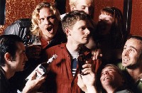 Falstaff and the tavern dwellers surround Prince Hal in our production of Henry IV: The Impact Remix. Photo by Cheshire Isaacs.