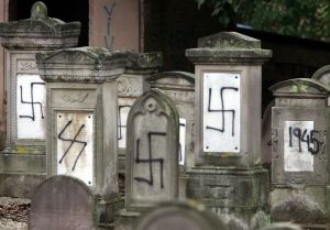 Graves desecrated by vandals with Nazi swastikas and anti-semitic slogans in the Jewish cemetery of Brumath close to Strasbourg, October 31, 2004. Jewish cemeteries have been, and continue to be, targeted as antisemitism rises in France. (photo: Reuters)