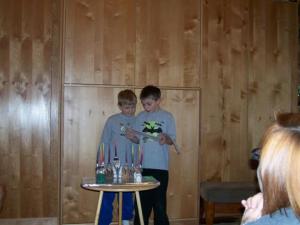 My boys lighting the Chanukah menorah, 2006.