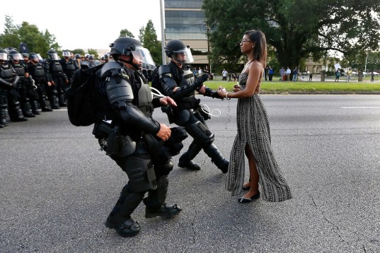 Demonstrators protesting the shooting death of Alton Sterling gather near the headquarters of the police department in Baton Rouge, Louisiana