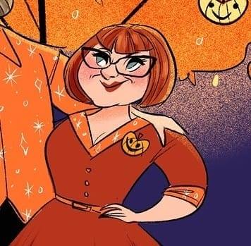 Cartoon image of Melissa in a red-orange shirtwaist dress with orange details, including a pumpkin brooch. Melissa has short red hair with bangs and wears black-framed glasses. 